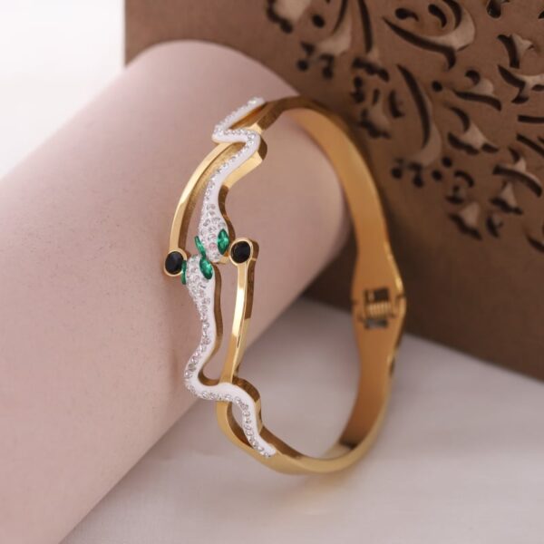 Ophira Golden Snake kada with saphire stpne eyes 3