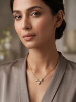 Elegant gold bow necklace with heart pendant