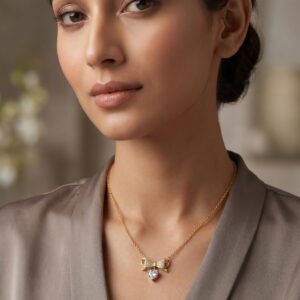 Elegant gold bow necklace with heart pendant