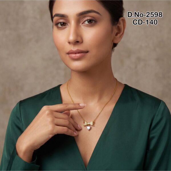 Elegant gold bow necklace with heart pendant