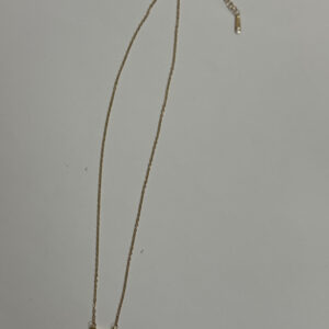 Elegant gold plated heart necklace on white surface