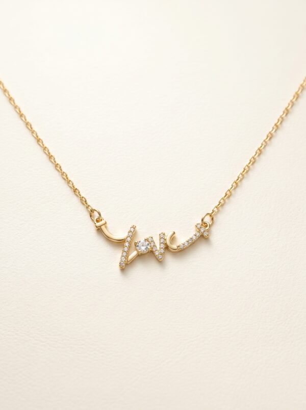 Close up detail of gold plated heart necklace with crystal pendant