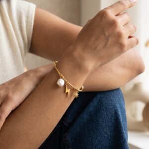 gold plated bracelet with sun and lightning charms