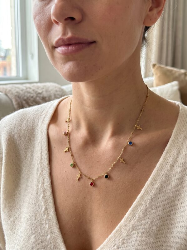 aura cross gold plated necklace gal 1 Multi-colored gem and cross charm gold plated necklace on display