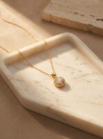 Elegant gold plated heart necklace on black velvet