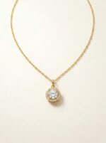 Elegant gold plated heart necklace on black velvet
