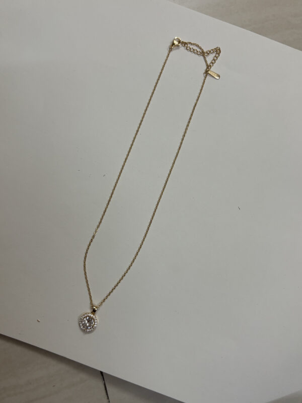 Elegant gold plated heart necklace on black velvet