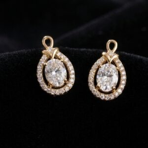 Close up of gold plated stud earrings on black velvet