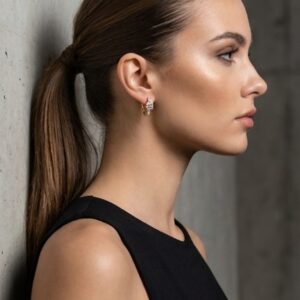 Woman wearing Aurelia Geometric Hoop Earrings in profile view