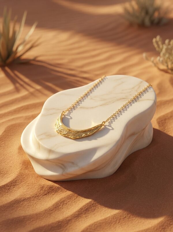 Full length view of the Crescent Moon Golden Necklace against a white background