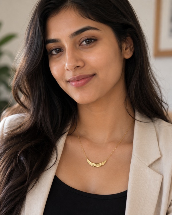Full length view of the Crescent Moon Golden Necklace against a white background