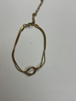 Eternity Knot Gold Bracelet on white background