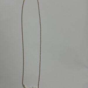 Close up of floral leaf necklace on black velvet display