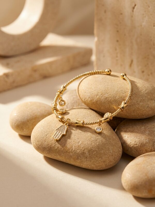 A model wearing the delicate Hamsa Protection Golden Bracelet on her wrist