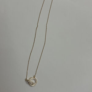 close up of gold plated necklace with crystals