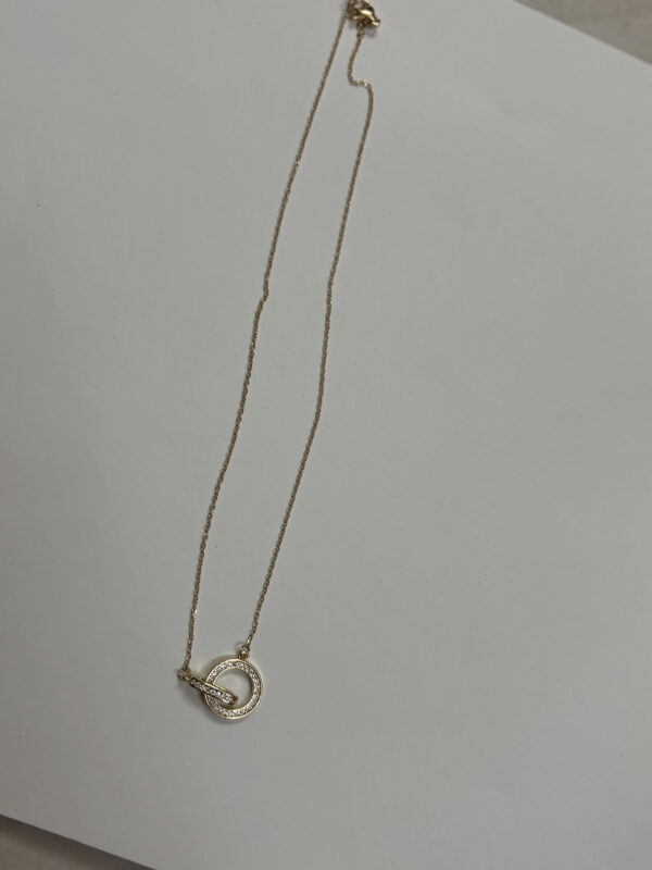 close up of gold plated necklace with crystals