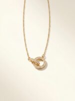 lifestyle shot of gold plated necklace on stone