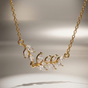 A model wearing an elegant gold plated necklace with a leaf design
