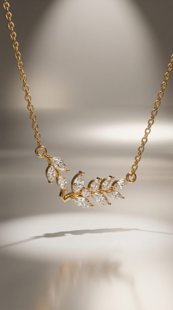 A model wearing an elegant gold plated necklace with a leaf design