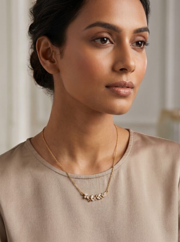 laurel leaf gold plated necklace gal 1 A delicate gold plated necklace featuring a leaf motif with sparkling marquise stones