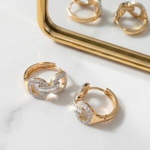 Detailed view of gold plated hoop earrings with sparkle detail