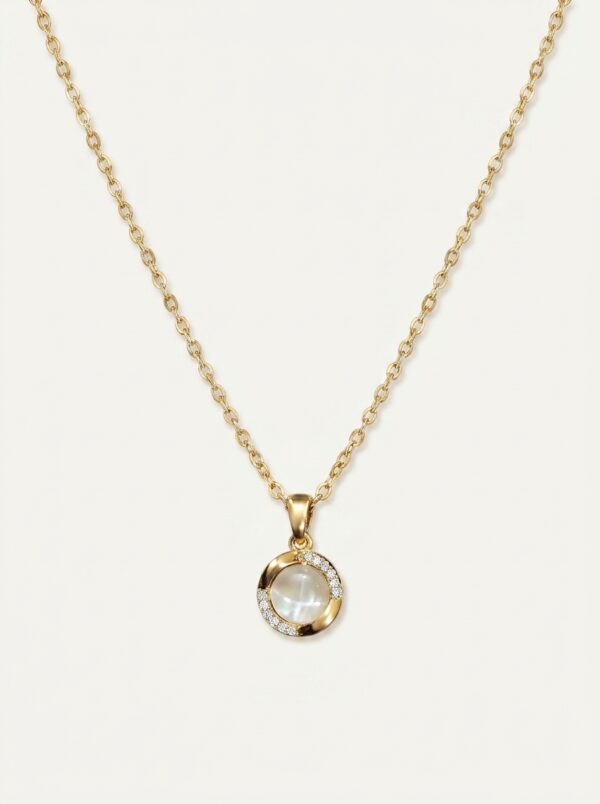 Lumina gold plated necklace with pearl pendant on black velvet