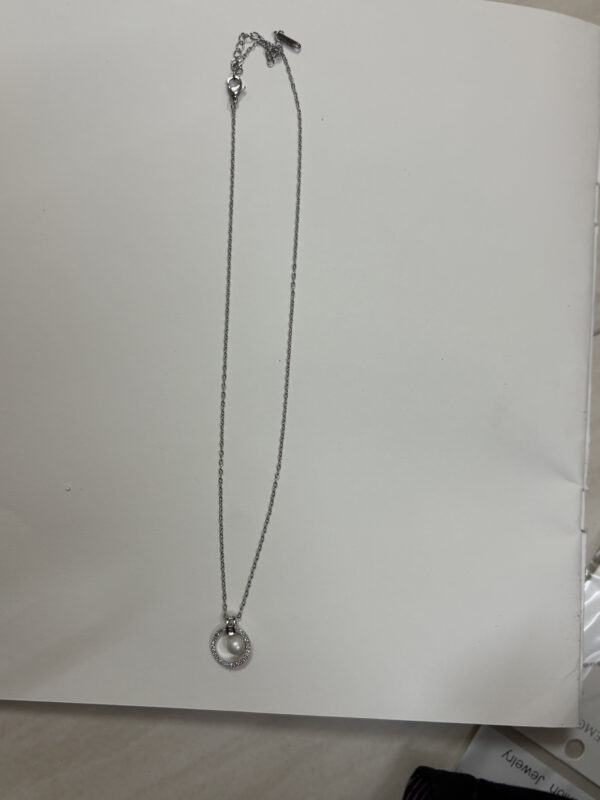 Lumina pearl necklace on black velvet display