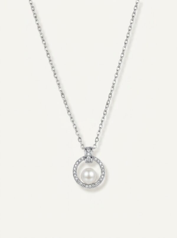 Silver pearl pendant necklace on white background