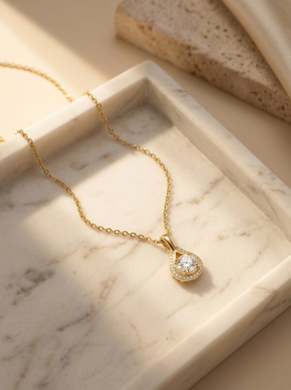Lumina Gold Plated Pendant Necklace on a desert-inspired stone display
