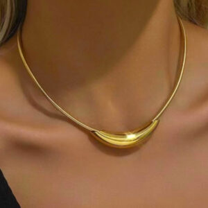 Model wearing sleek golden choker necklace