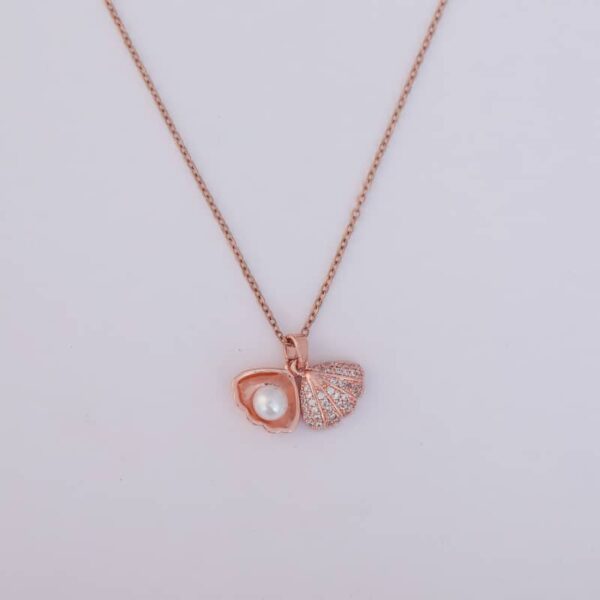 A woman wearing a beautiful Pearl Shell Pendant Necklace