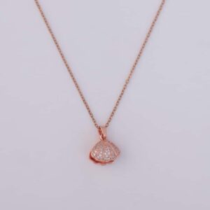 A close-up of the Pearl Shell Pendant Necklace on a black velvet box