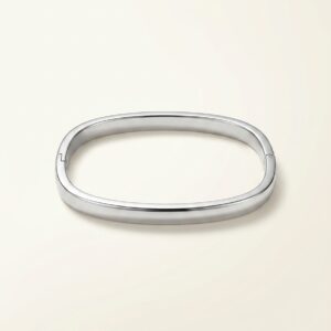 The Serene Silver Kada elegantly placed on a soft stone surface
