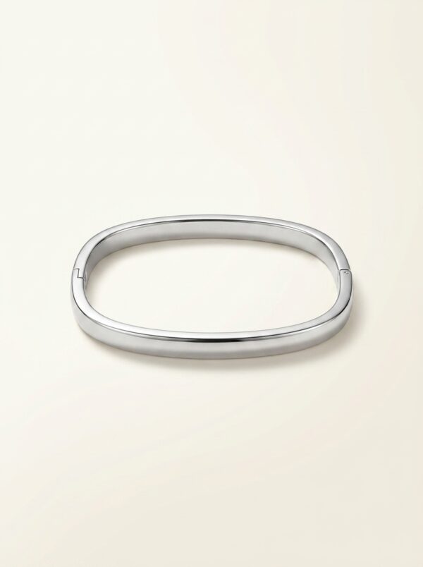 The Serene Silver Kada elegantly placed on a soft stone surface