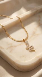 Woman wearing elegant gold plated snake necklace