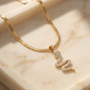 Woman wearing elegant gold plated snake necklace