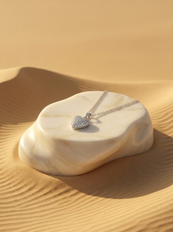 Starlight Paved Heart Necklace on desert-inspired podium