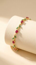 Full view of the gold plated ruby bracelet on a white background