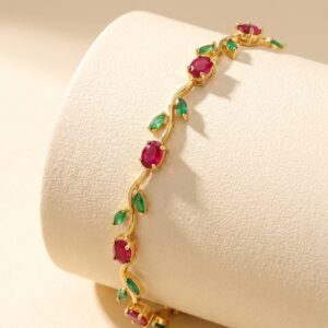 Full view of the gold plated ruby bracelet on a white background