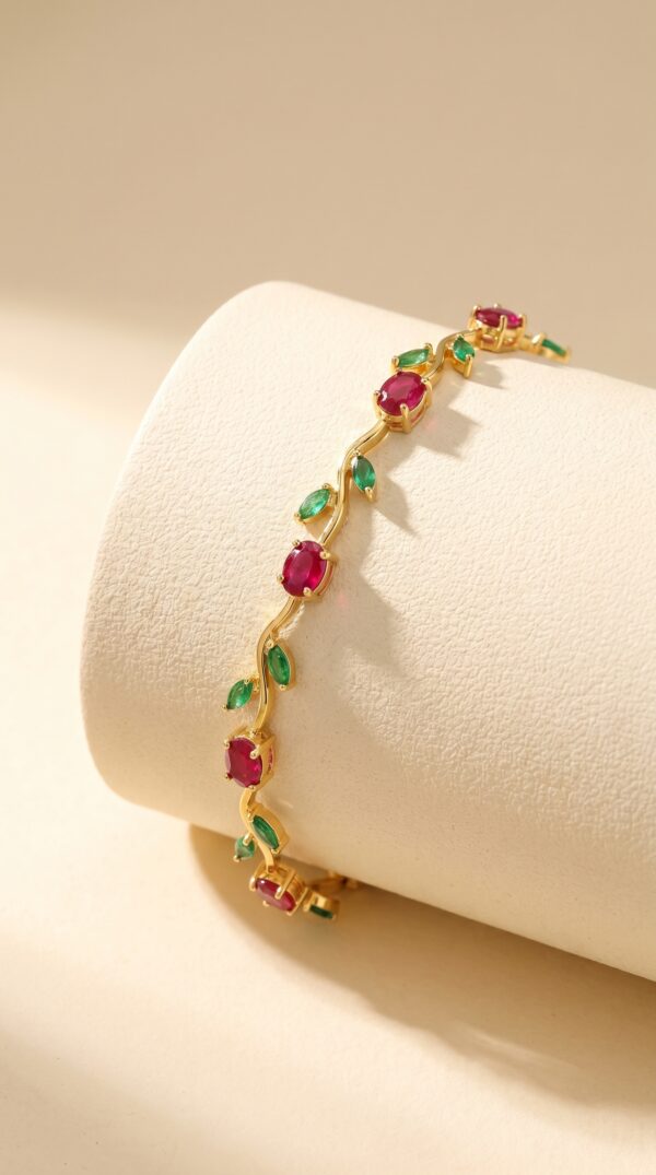 Full view of the gold plated ruby bracelet on a white background