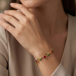 Close up of the gold plated ruby bracelet with green leaves