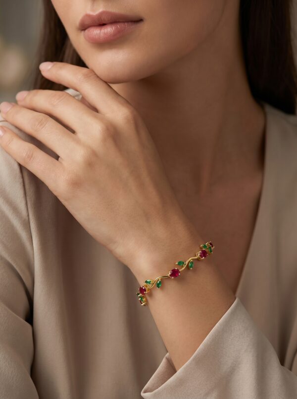 verdant bloom ruby bracelet gal 2 Close up of the gold plated ruby bracelet with green leaves