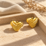 Golden heart earrings featuring wrapped detail