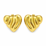 Pair of glossy gold heart earrings isolated on white