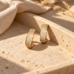 Two crystal hoop earrings on a white background