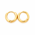 A pair of polished gold hoop earrings on a white background