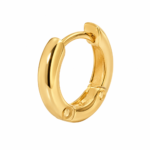 Model wearing simple gold hoop earrings showing scale and fit