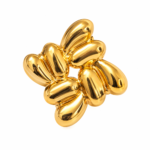Close up of sculptural gold earrings design