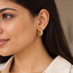 Model wearing gold pavé hoop earrings