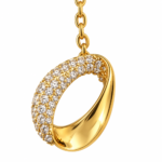 Macro shot of the pendant detail on the gold plated necklace